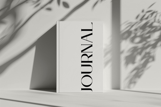 Journal book with shadows of leaves on a light background